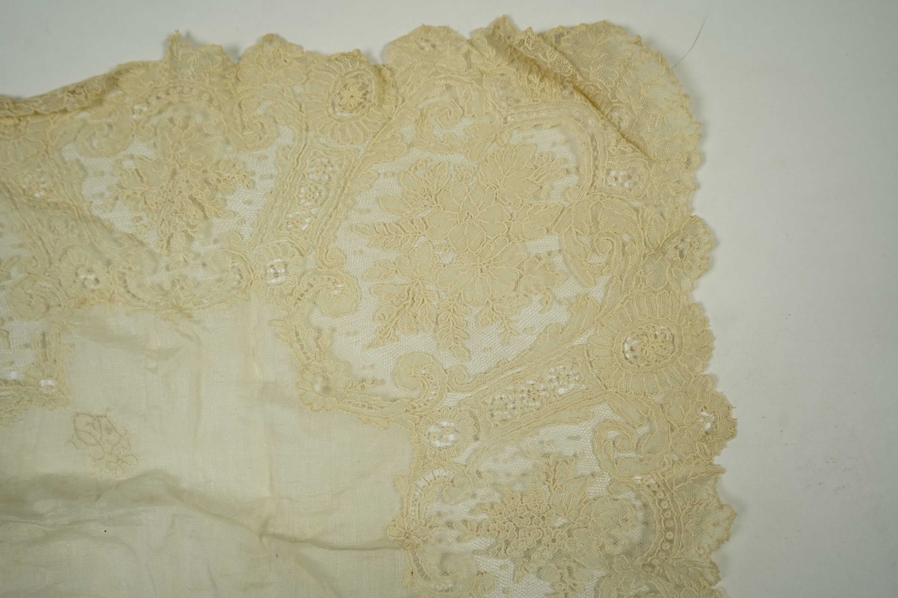 A 19th century Brussels Point de Gaz needle lace collar, lappet and wedding hankie, possibly part of a trousseau. The collar having thirty four needle lace raised flower heads within the design. The collar 100cm long x 1